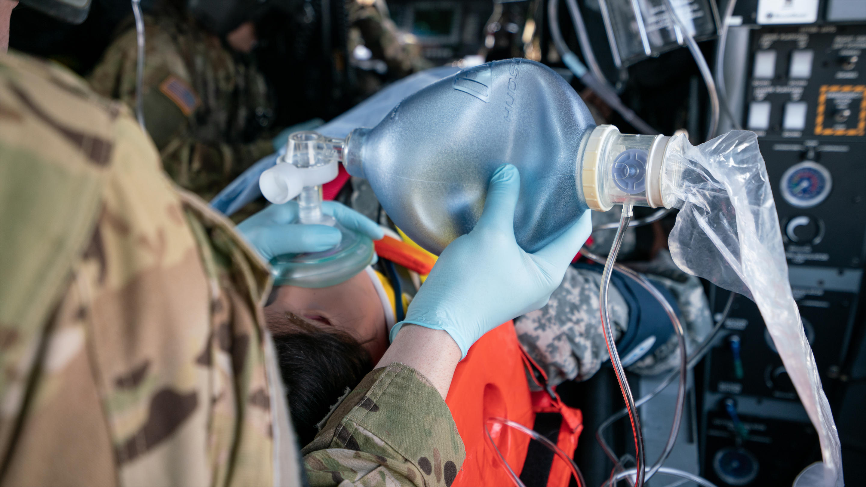 Soldier using Bag-Valve-Mask to ventilate a simulated trauma patient