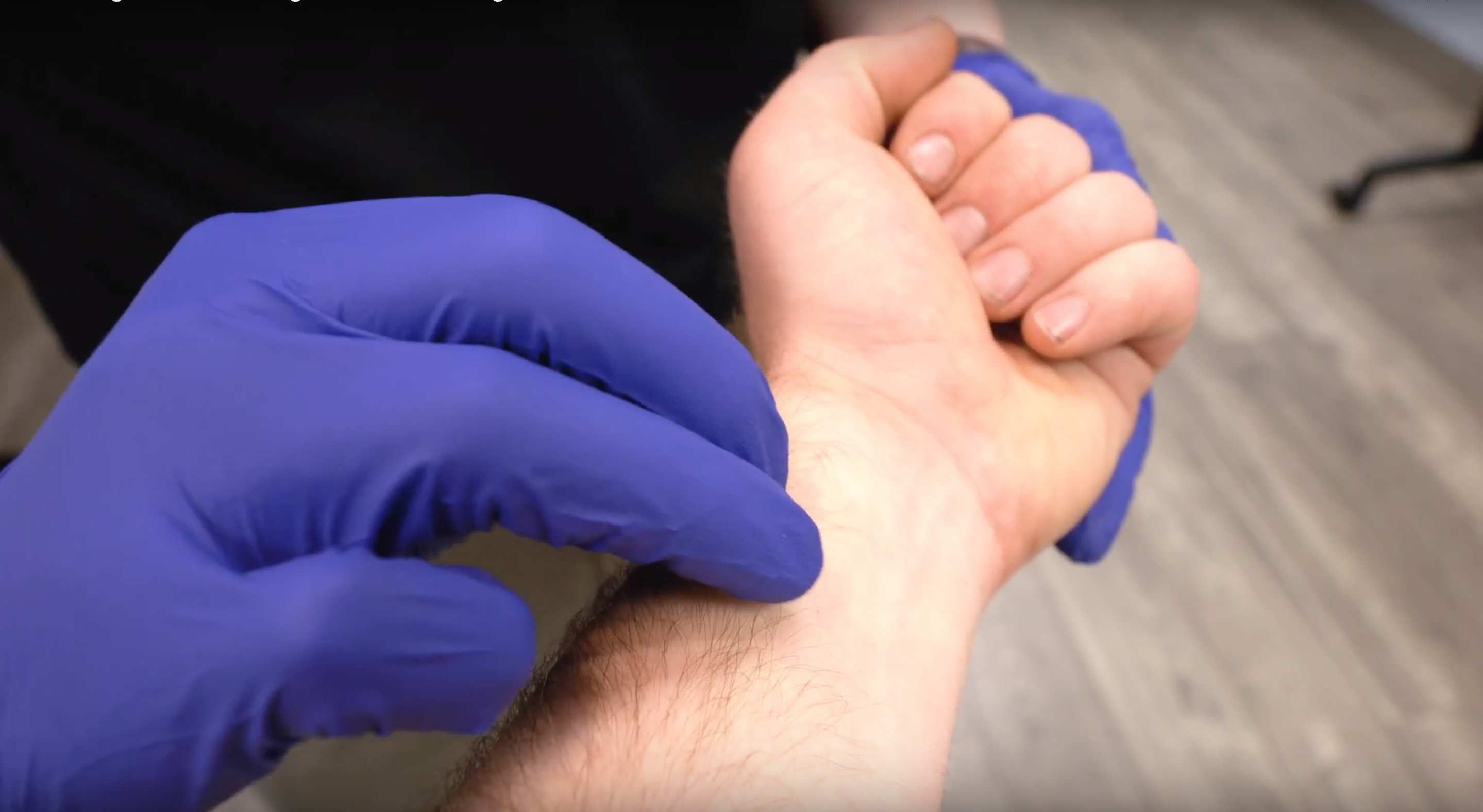 Palpating a radial pulse an a patients wrist